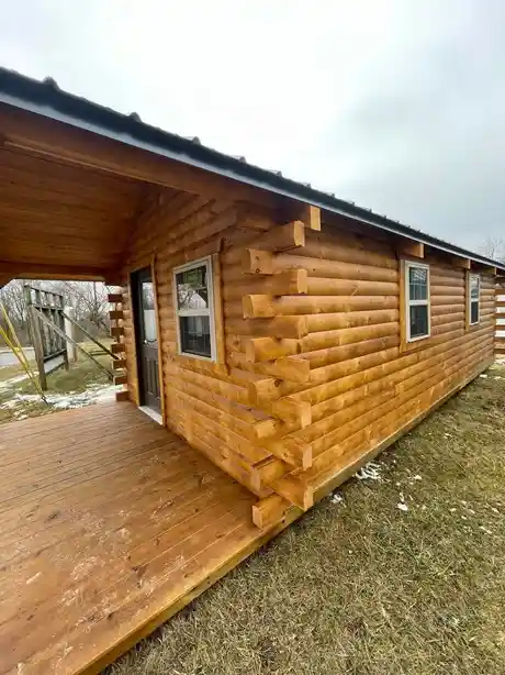 wood log cabin with windows and door
