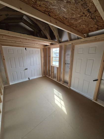 8x12 lofted barn with metal siding and double doors