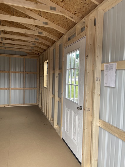 10x20 utility with metal siding with custom black paint on doors