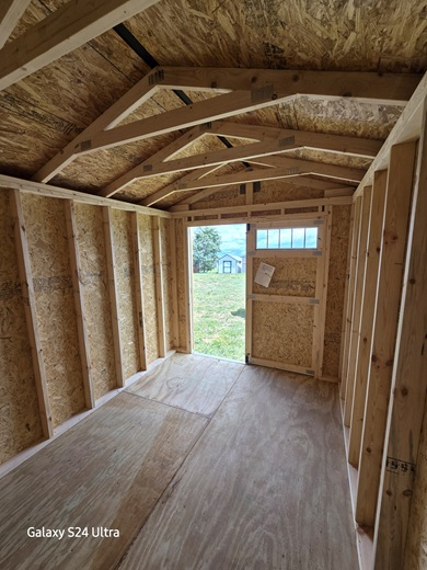 8x12 utility with 7 foot walls and double doors with windows