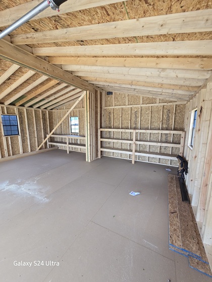24x24 double wide garage with shelves and workbench