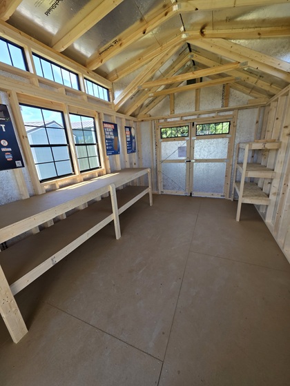 10x20 playhouse utility with vaulted gable has a 10 Ft workbench and 4 shelves