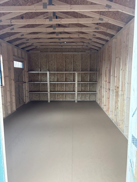 12x20 utility with 8 foot walls and shelves inside