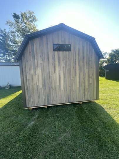 12x24 lofted barn with metal siding and double doors with windows