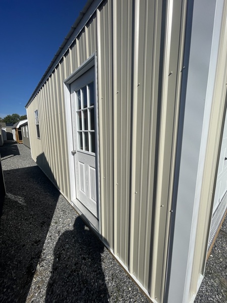 24x24 double wide garage with metal siding and 8 foot walls and door with windows