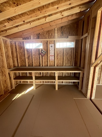 24x24 double wide garage with metal siding and 8 foot walls and workbench