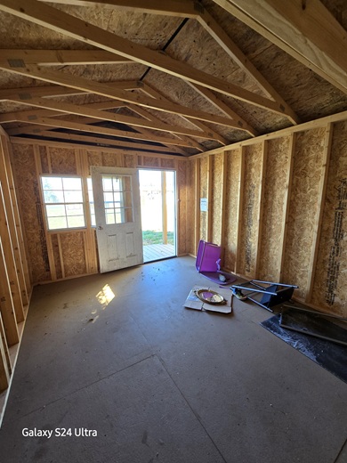 look inside 12x20 Playhouse with center porch package in WV