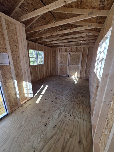 look inside 12x20 utility building with side porch